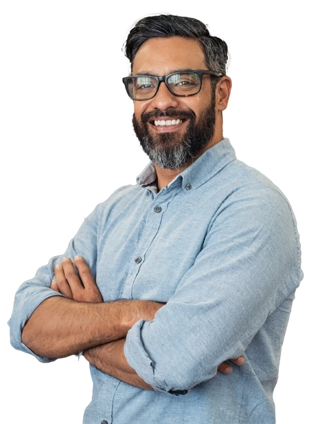 a smiling bearded man wearing glasses and a blue shirt