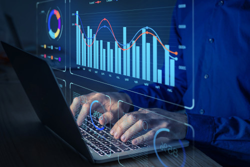 
                      Visualisations of statistics superimposed over an image of a person using a laptop
                    